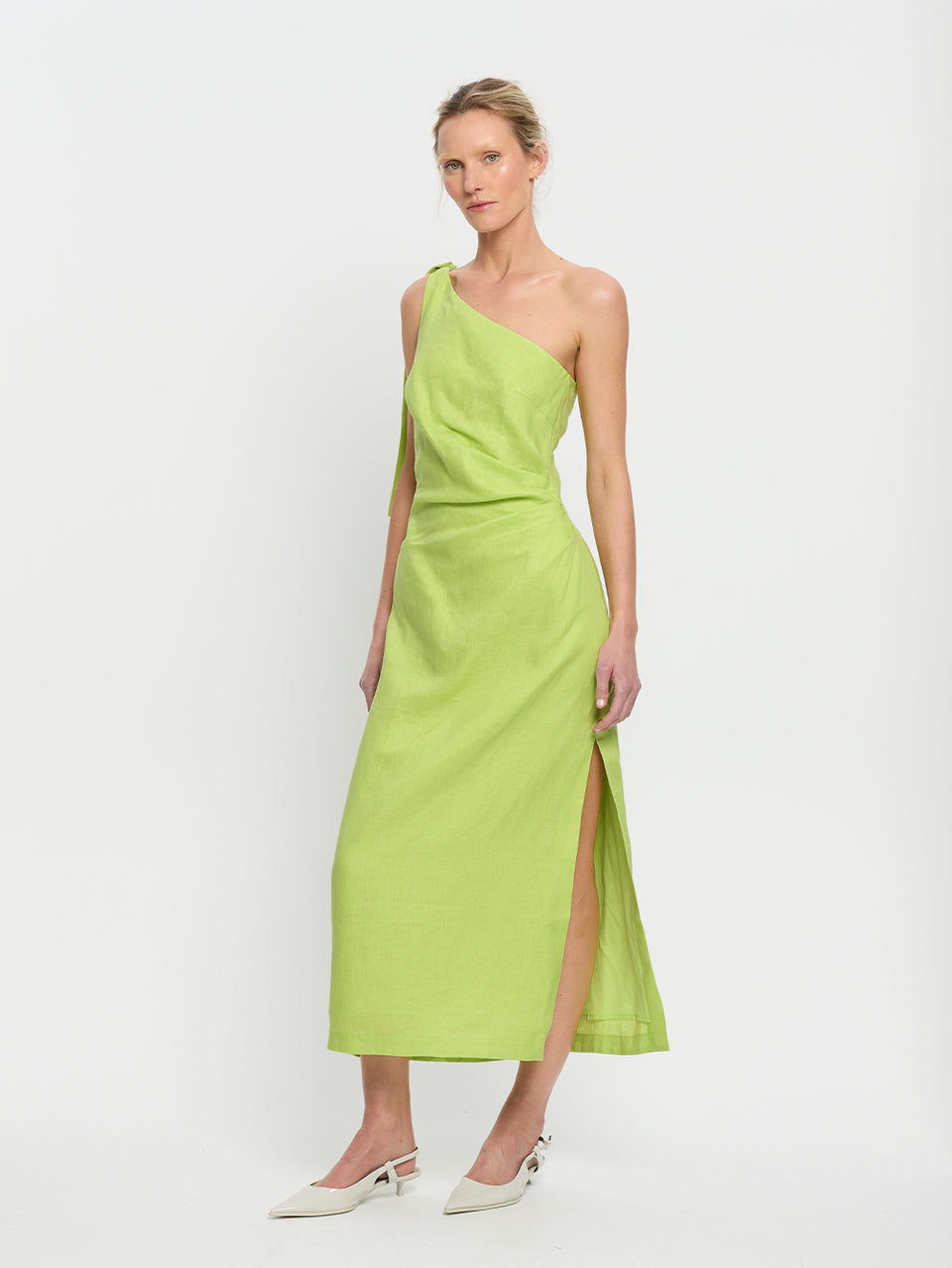 Addison Midi Dress KIVARI | Model wears green one shoulder linen midi dress side view