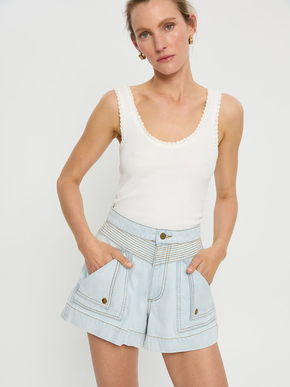 Celene Denim Short Pale Wash KIVARI | Model wears light blue denim shorts