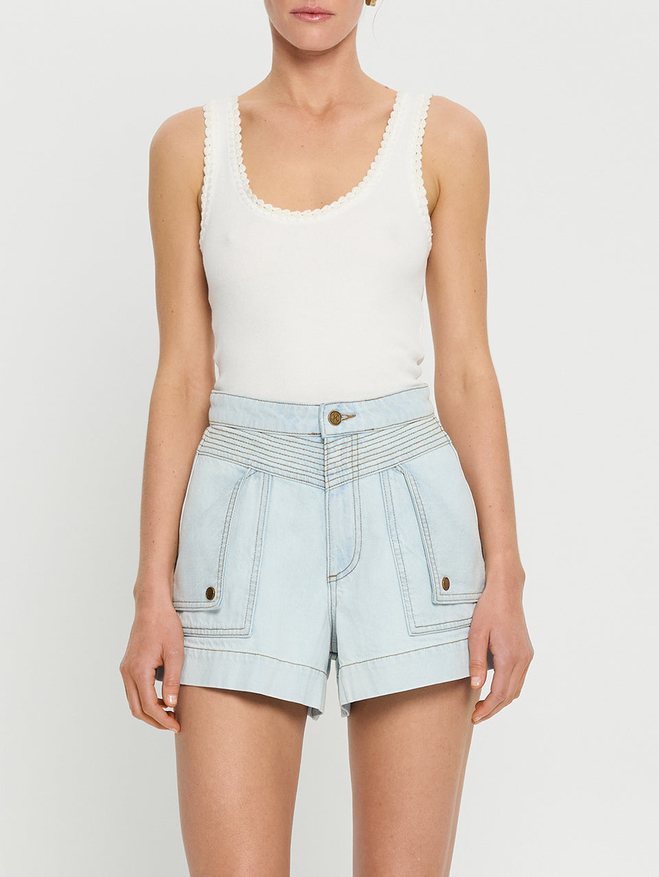 Celene Denim Short Pale Wash KIVARI | Model wears light blue denim shorts