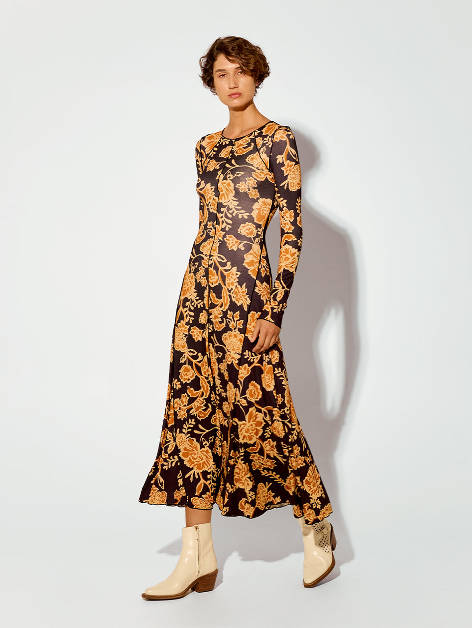 Kaia Knit Dress KIVARI | Model wears black and orange floral knit dress side view