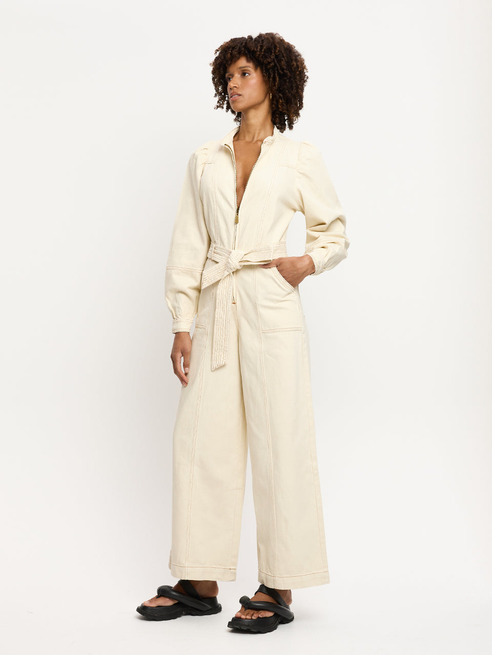 Lourdes Boilersuit Cream KIVARI | Model wears cream denim boilersuit side view