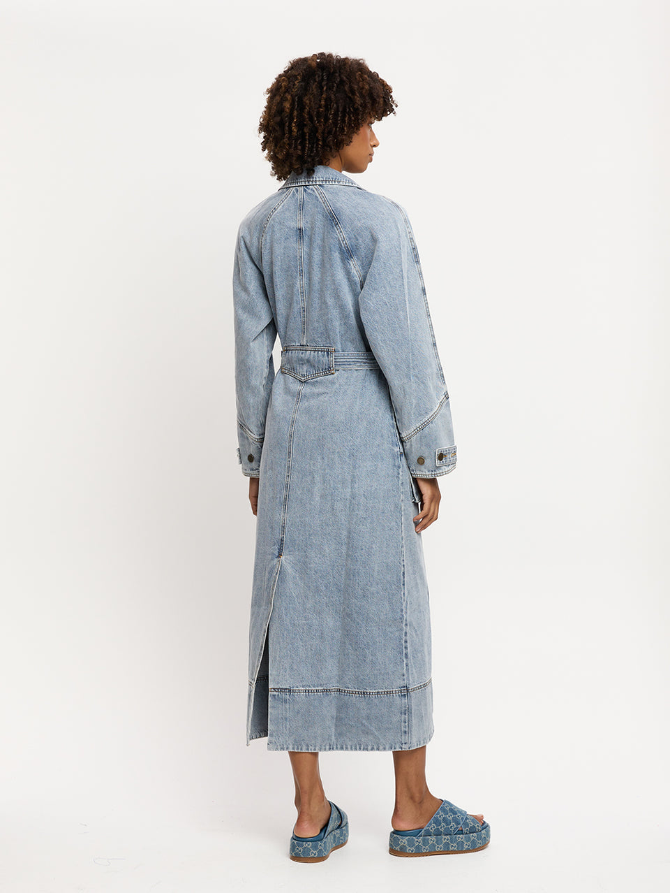 Olivia Denim Trench Coat KIVARI | Model wears light blue wash denim trench coat back view