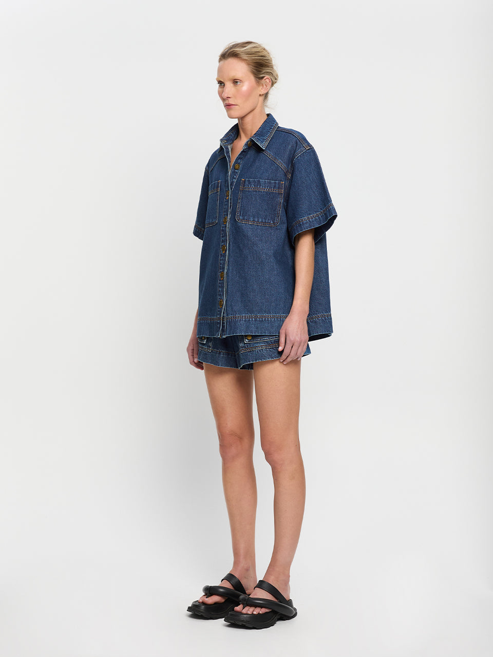 Paloma Shirt Indigo KIVARI | Model wears indigo denim shirt side view