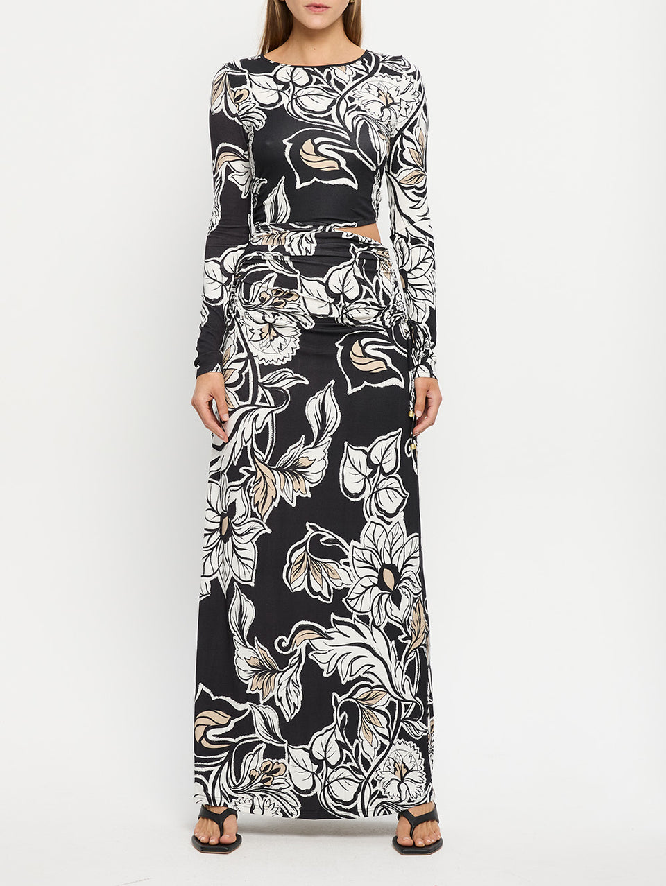 Alma Knit Maxi Dress KIVARI | Model wears black and white floral maxi dress 