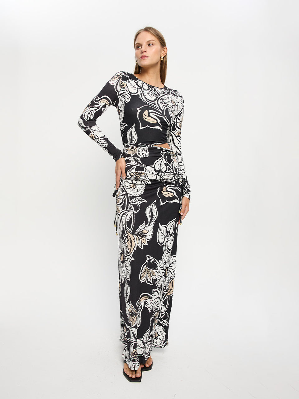 Alma Knit Maxi Dress KIVARI | Model wears black and white floral maxi dress 