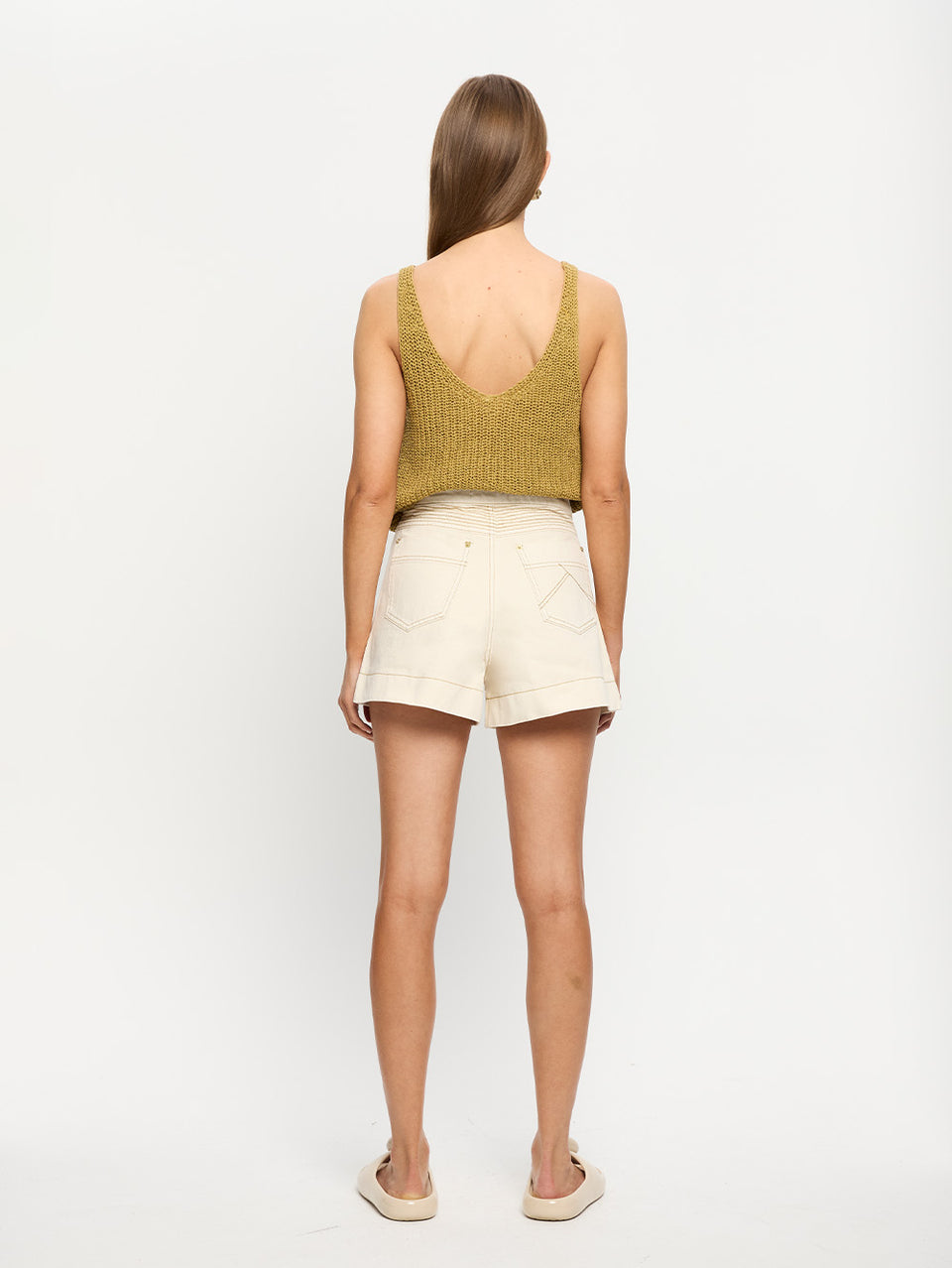 Celene Denim Short - Cream | Model wearing cream shorts with khaki knit cami