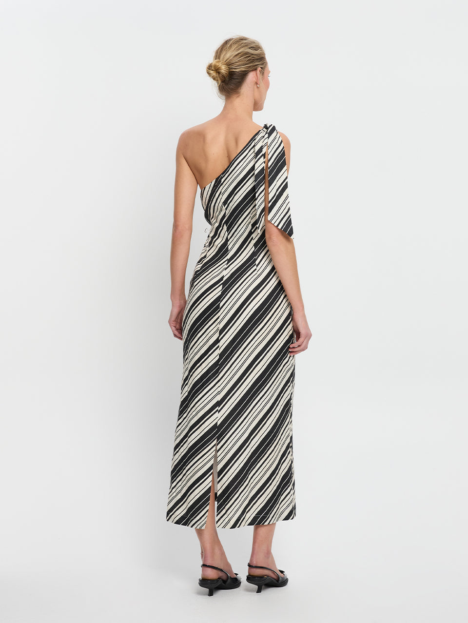 Sara Midi Dress KIVARI | Model wears stripe one shoulder linen midi dress back view