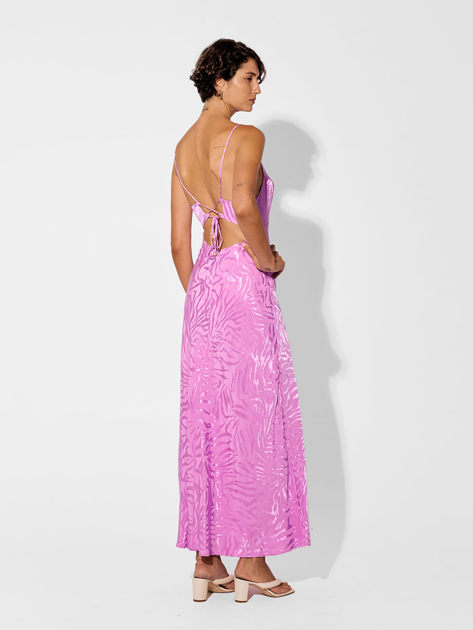 Stela Slip Dress KIVARI | Model wears pink zebra print dress back view