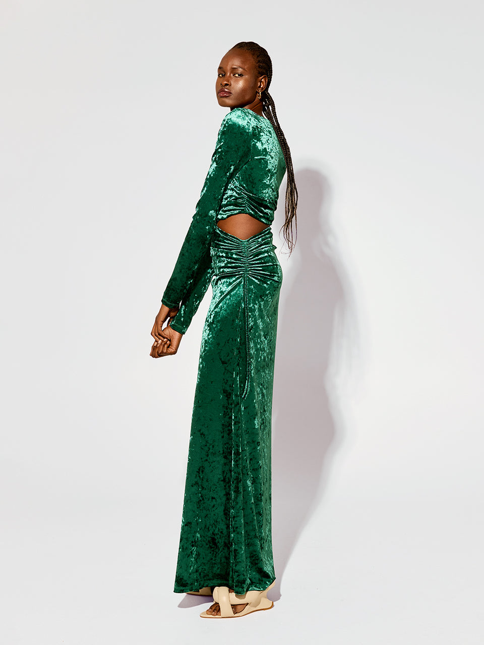 Violetta Maxi Dress KIVARI | Model wears emerald green velvet dress side view