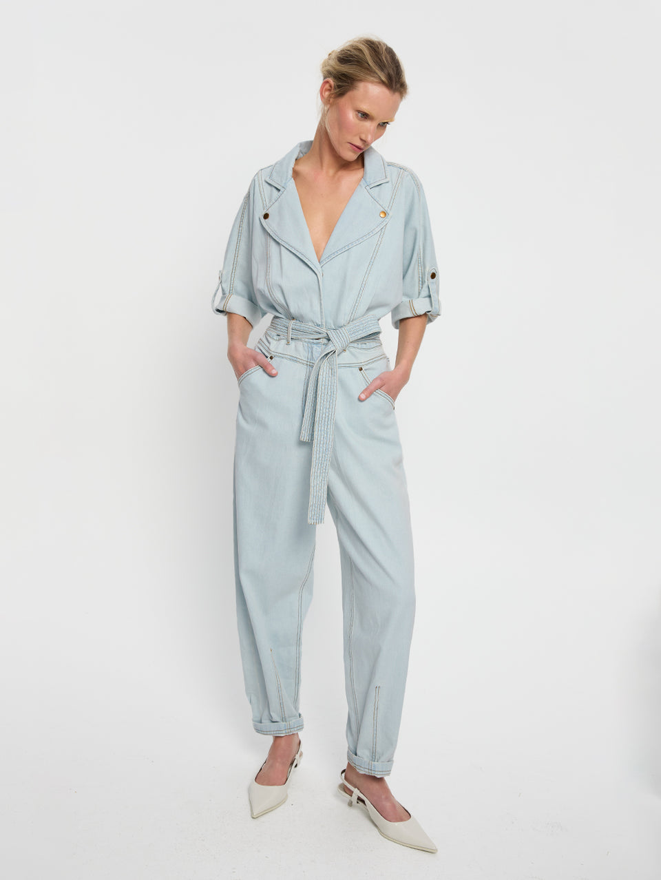 Adina Boilersuit Pale Blue KIVARI | Model wears light blue denim boilersuit