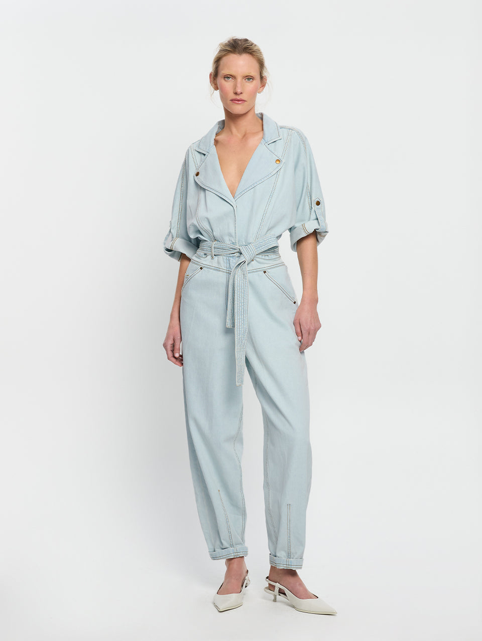 Adina Boilersuit Pale Blue KIVARI | Model wears light blue denim boilersuit