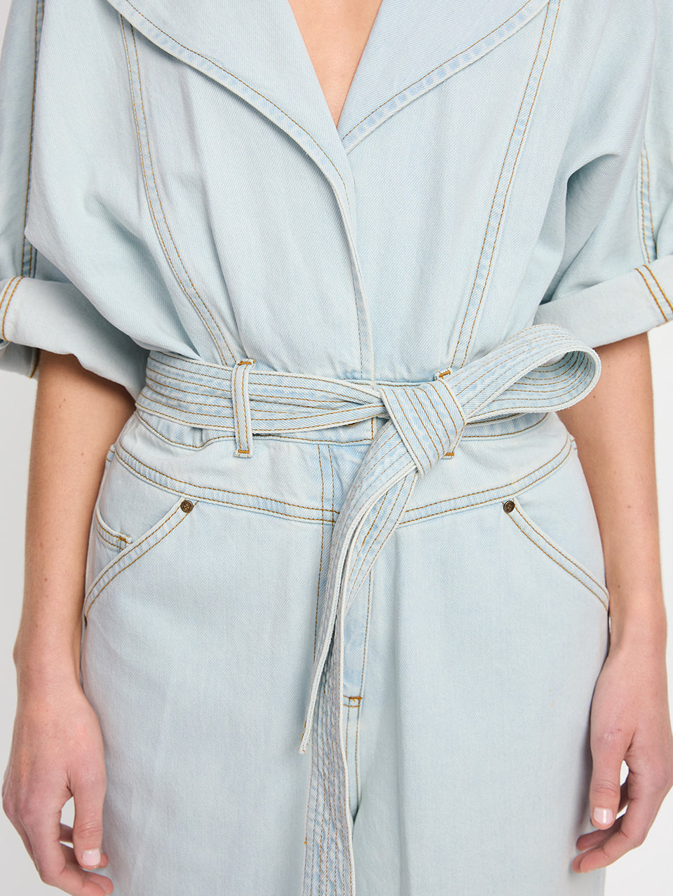 Adina Boilersuit Pale Blue KIVARI | Model wears light blue denim boilersuit close up