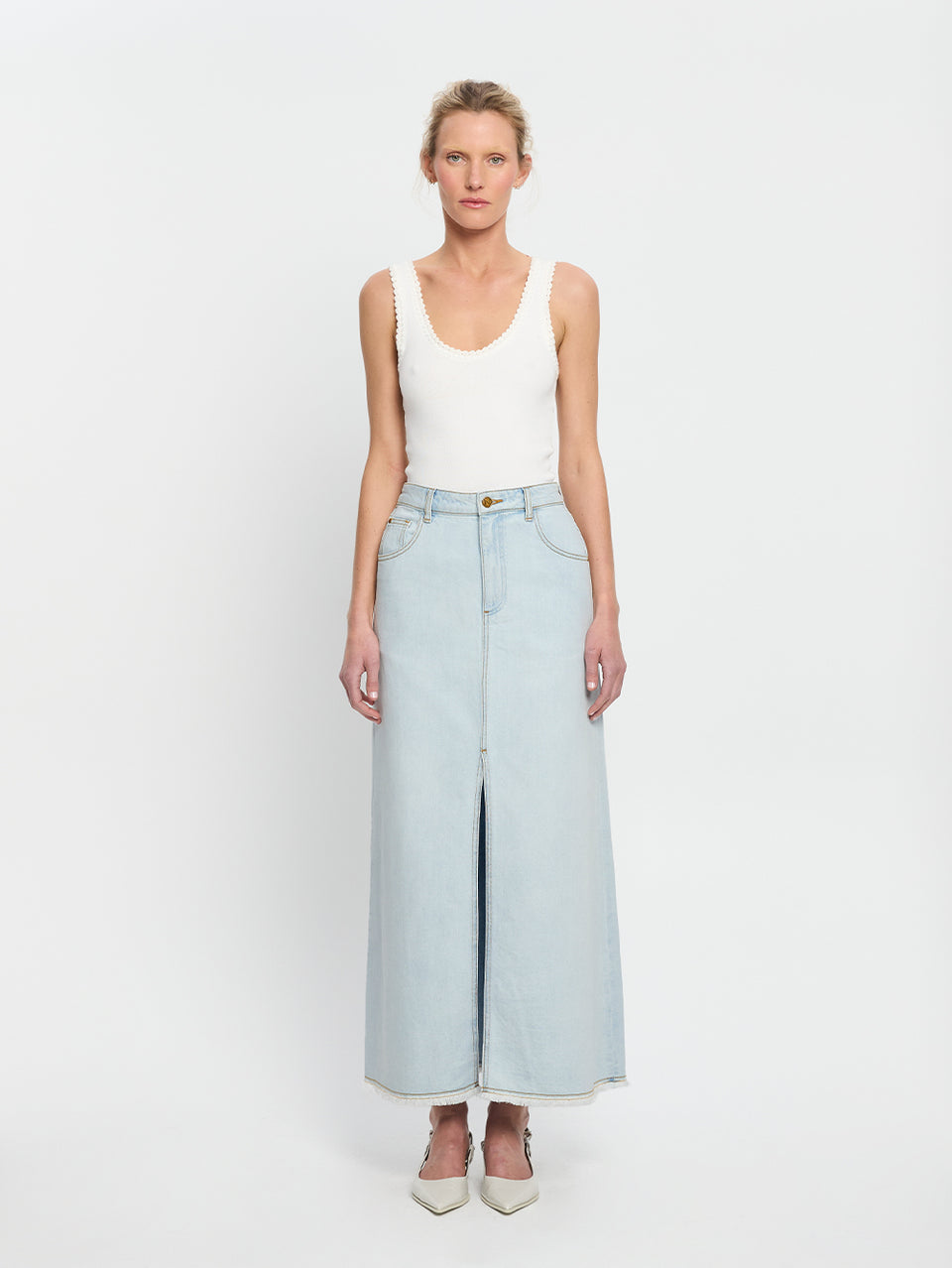 Zoya Skirt KIVARI | Model wears pale blue denim skirt