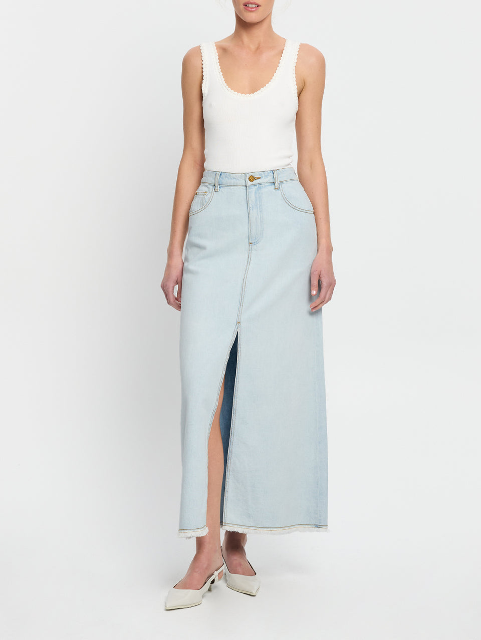 Zoya Skirt KIVARI | Model wears pale blue denim skirt